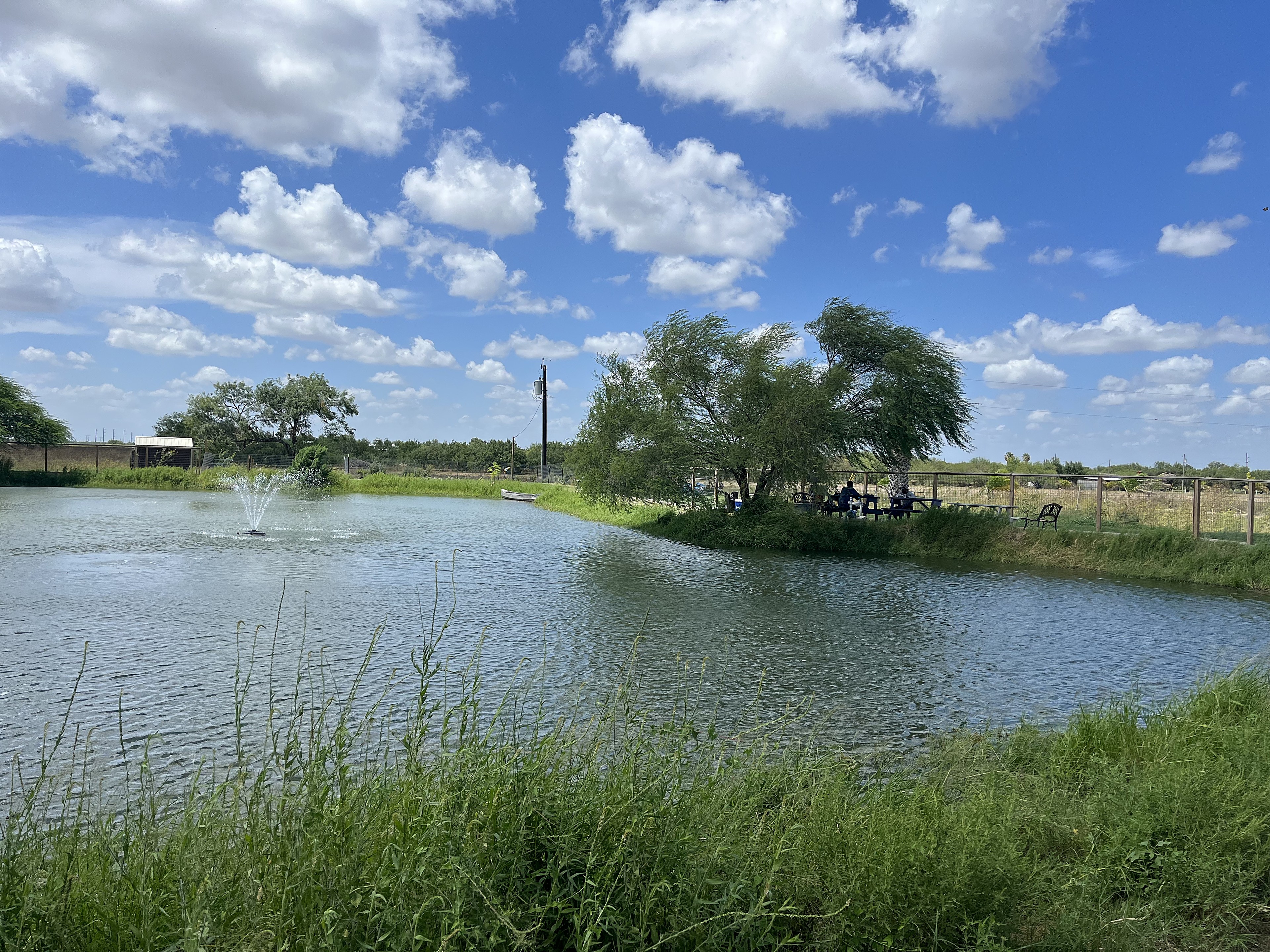The community pond at Rio Grande Estates under a wide South Texas sky in Edinburg, Texas